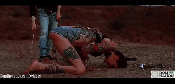  Ass eating bondage slave cries while her feet get caned outdoors in the dirt - Rocky Emerson